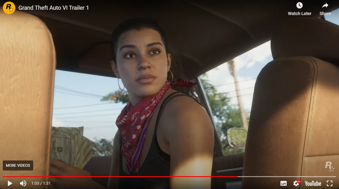 A screenshot of a youtube video in which GTA 6 protagonist Lucia siting in a car with bundle of dollar in her hand.